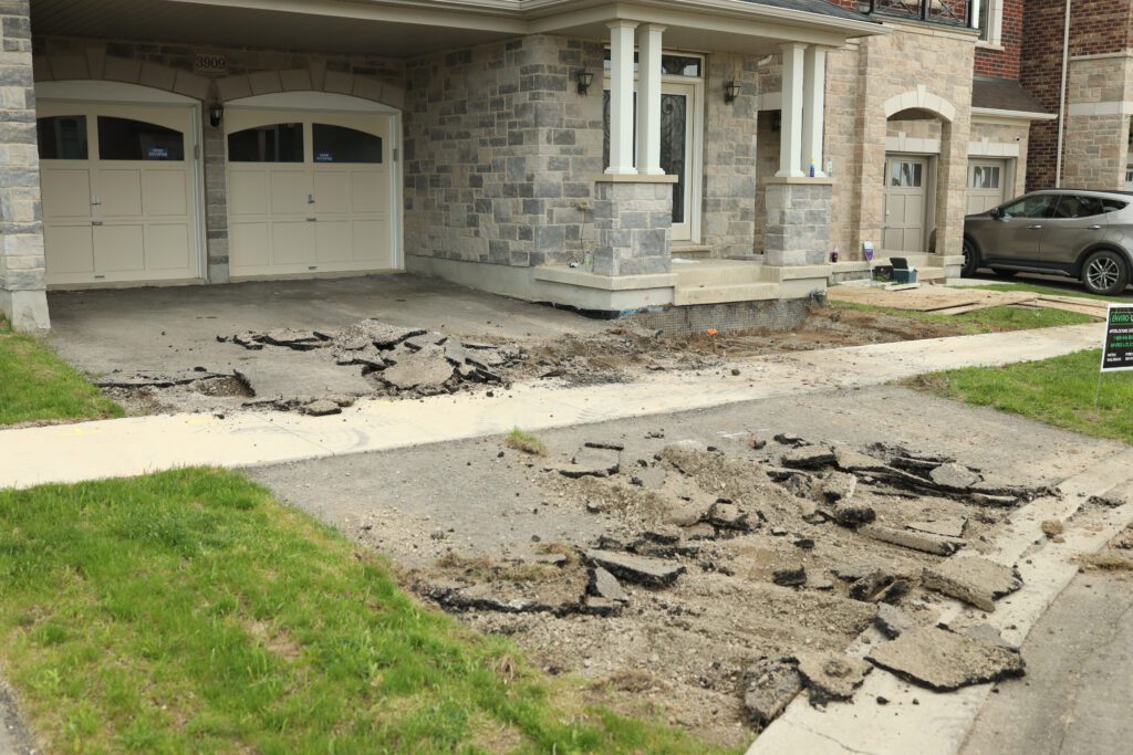 Gravel driveway in the process of being removed