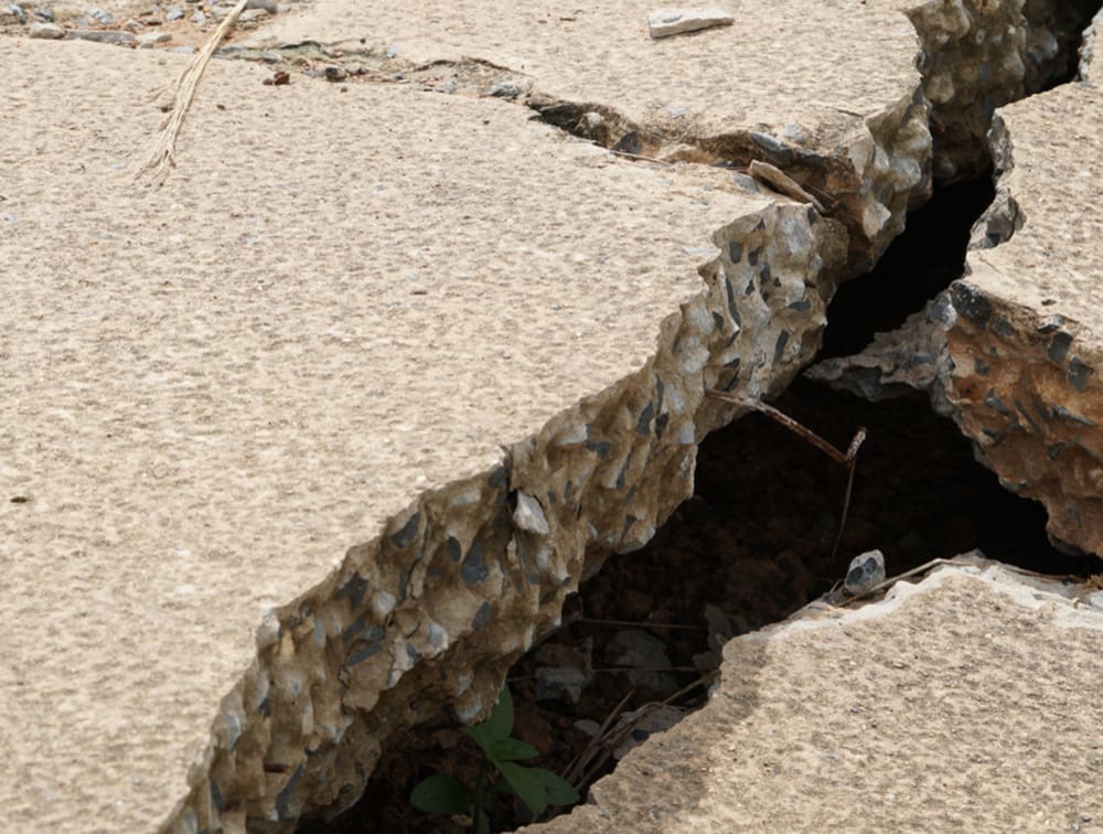 Concrete driveway with a large fissure 