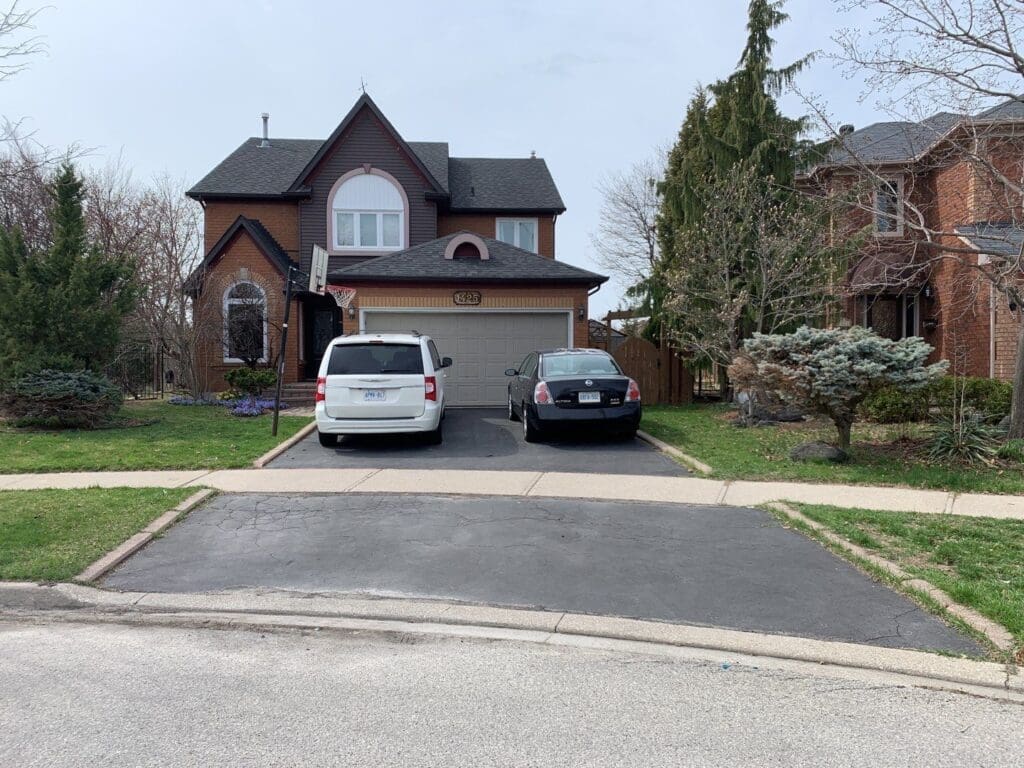 Asphalt driveway with some cracks