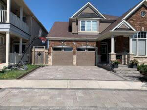 Driveway with high-quality interlocked grey stones.