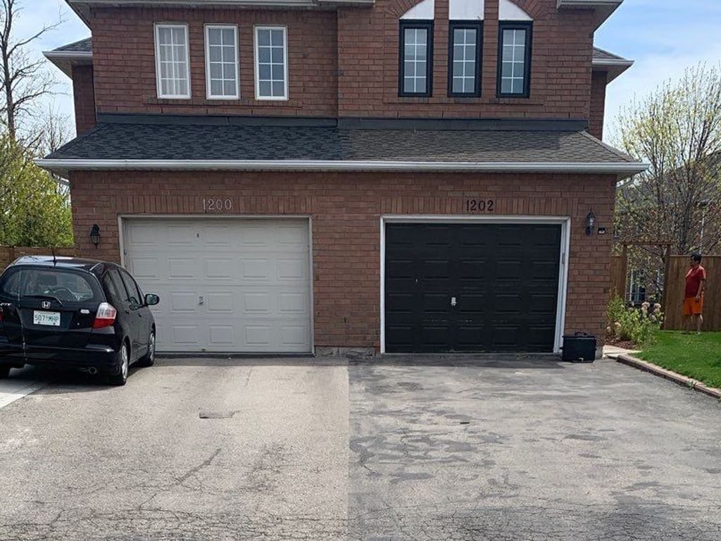 Residential asphalt that has cracks and discolouration