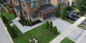 Interlocking-Driveway-On-A-Corner-House-With-Walkway-To-Entrance