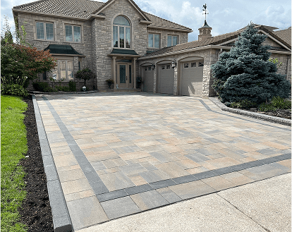 Property exemplifying interlocking paver stone work on a large-sized driveway