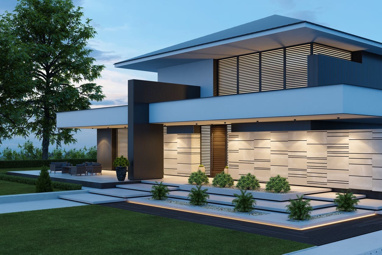Contemporary home with minimalist hardscaping, geometric concrete steps, accent lighting, and neatly arranged low-maintenance plants.