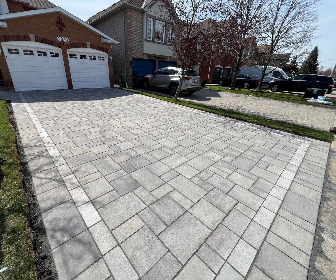Close-up of detailed interlocking driveway pavers with precision installation in Mississauga.